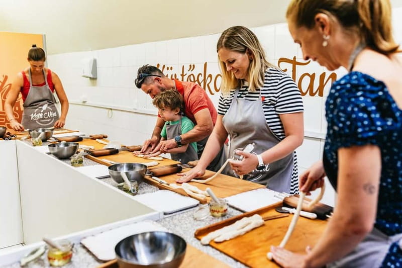 Budapest: Hungarian Chimney Cake Workshop in the City Center - Shaping three cakes around the cones