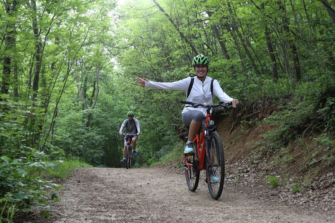 Budapest: Private Adventure Sightseeing Bicycle Tour - Crossing Margaret Bridge toward the hills